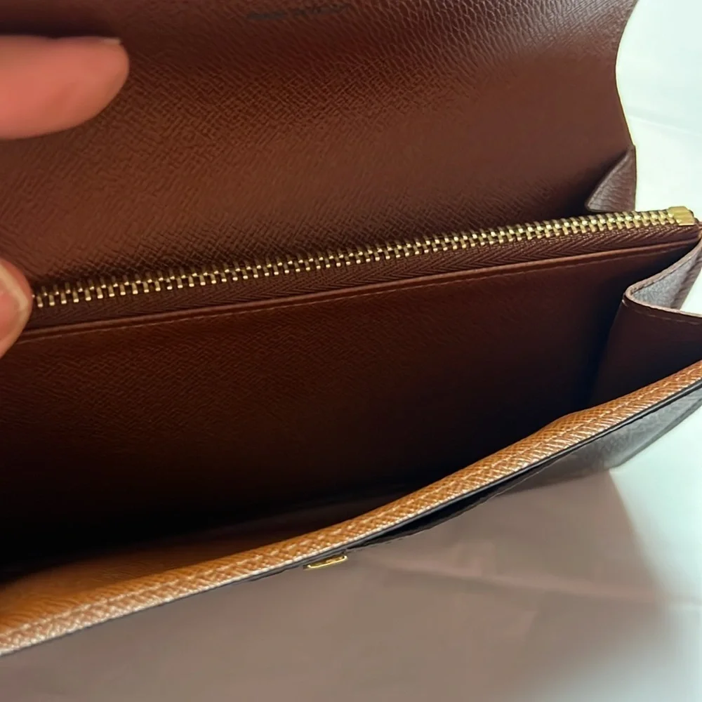 Louis Vuitton monogram sara long wallet.